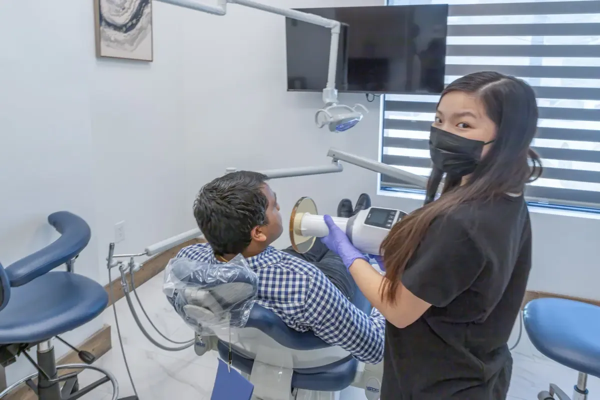 Dental assistant taking digital X-rays during a preventive dental exam at Shape Dental in Georgetown, TX