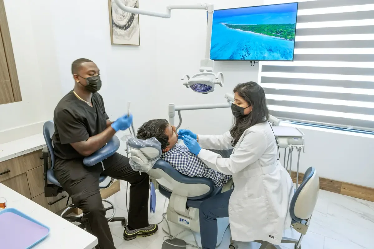 Dentist and assistant providing restorative dental treatment at Shape Dental in Georgetown, TX