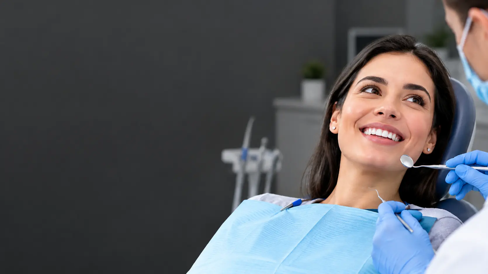 Patient smiling during a cosmetic dental visit at Shape Dental