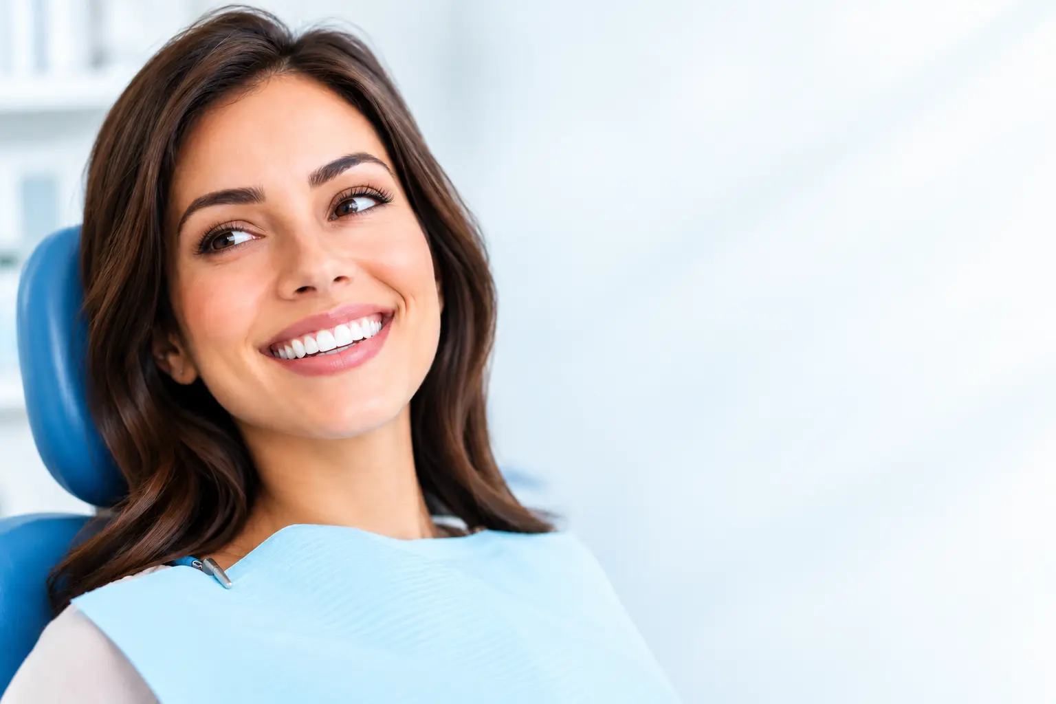 Patient smiling during a cosmetic dentistry visit at Shape Dental
